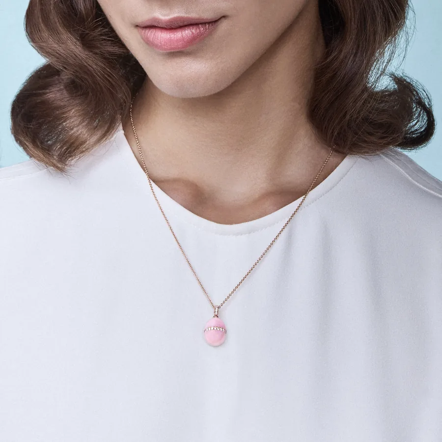 Model wearing the Fabergé Forever Pink Opal Egg Pendant