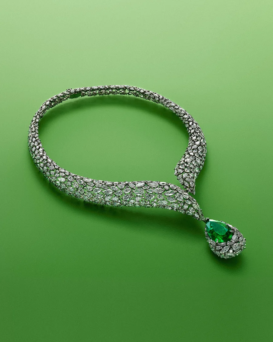 Messika Delta Sacré necklace from Terres de Contrastes with over 600 diamonds and a 12.81-carat pear-shaped emerald